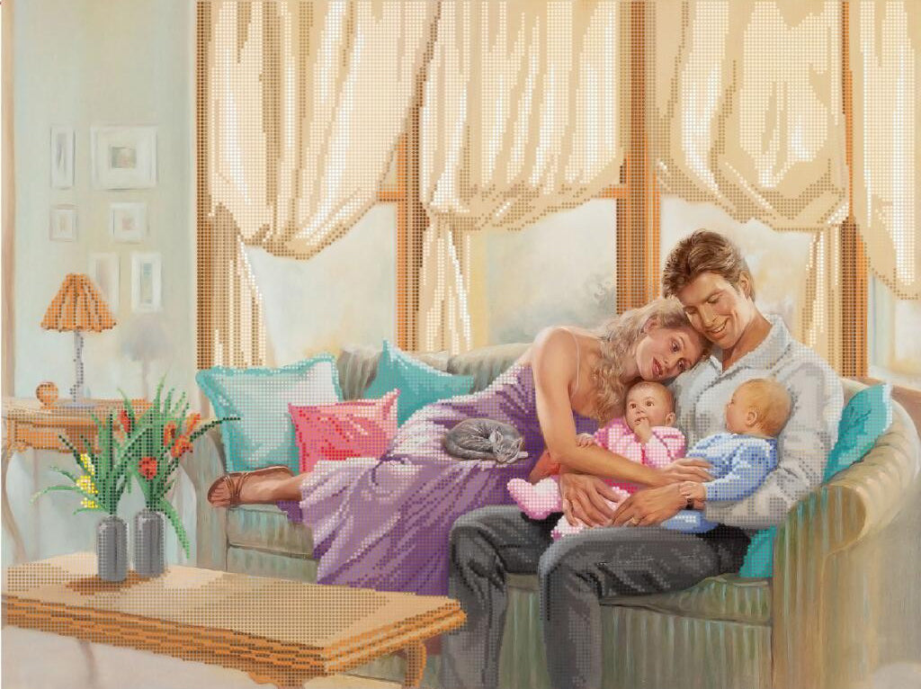 Family scene with a woman lying on a couch holding a baby, a man sitting next to her, and a child playing with toys.