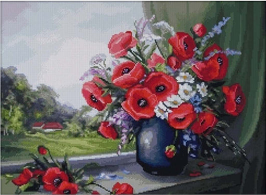 Bouquet of red flowers in a blue vase with a scenic background