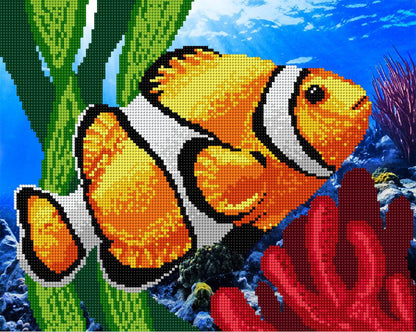 A bead embroidery kit depicting a colorful fish with a printed pattern on fabric, accompanied by beads and a needle, against a blue underwater scene with coral.