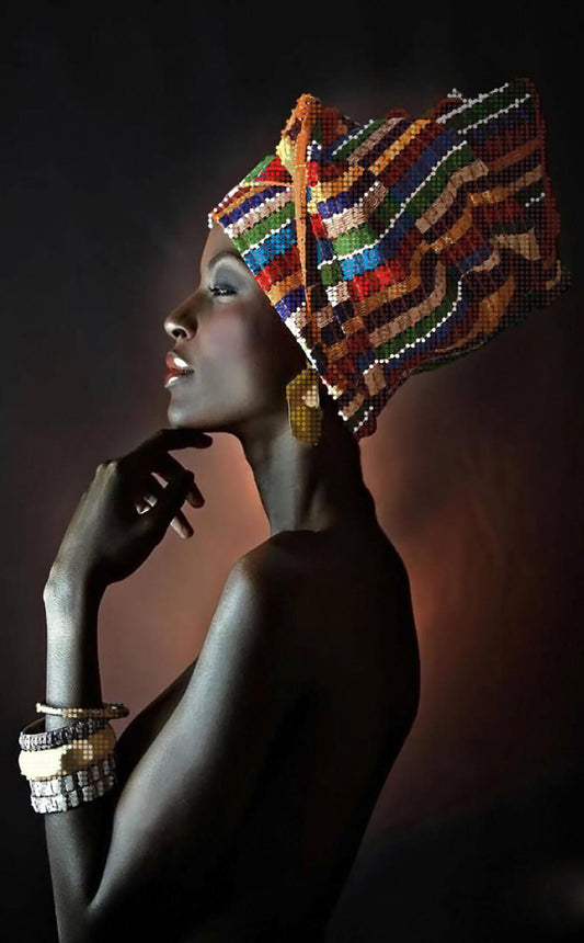 Woman wearing a colorful beaded headwrap against a dark background