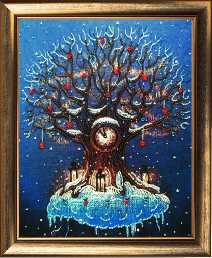 A beaded embroidery kit depicting a tree with a clock at its center, surrounded by blue fabric with a printed pattern, intended to be framed.