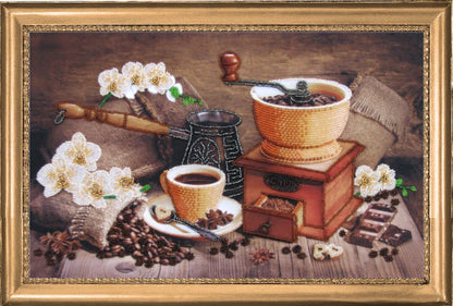 A bead embroidery kit depicting a coffee theme, with a coffee grinder, beans, and a cup arranged on a table, surrounded by decorative flowers.