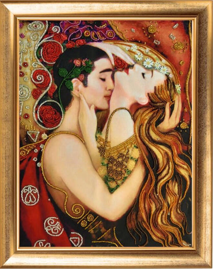A bead embroidery kit depicting two stylized female figures kissing, with intricate beadwork on a fabric base, framed in a golden frame.