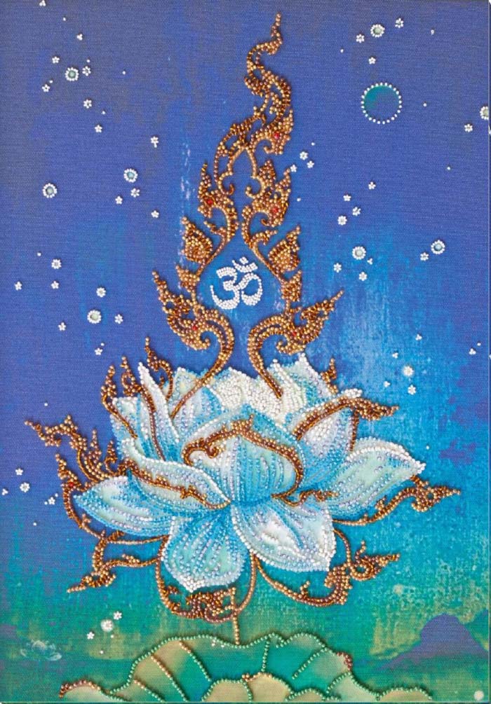 Decorative design of a blue lotus flower with gold accents and an 'Om' symbol on a blue background.
