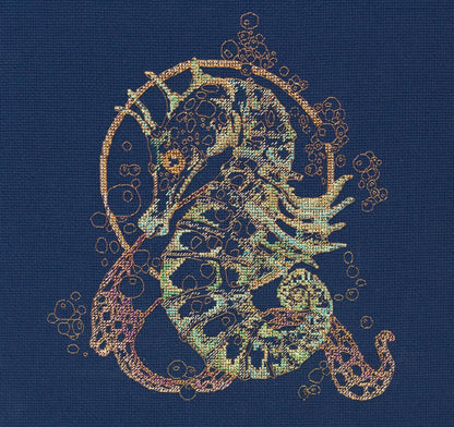 A cross stitch kit depicting a detailed sea horse design on a blue background, with multicolored threads used for embroidery.