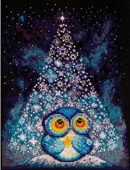 Cross stitch kit depicting a blue and white owl with a Christmas tree in the background, made with Aida fabric and threads.