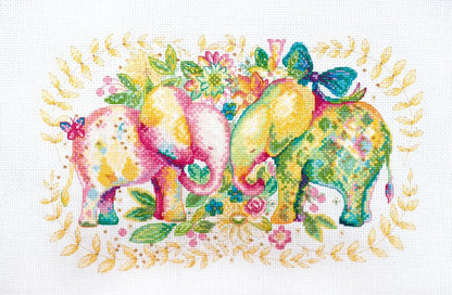 A cross stitch kit depicting two colorful elephants among floral elements, unframed.