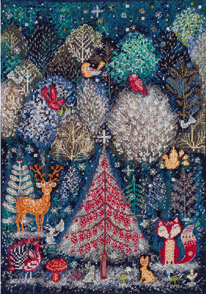 Cross stitch kit depicting a winter forest scene with trees, animals like deer and a fox, and a red Christmas tree.