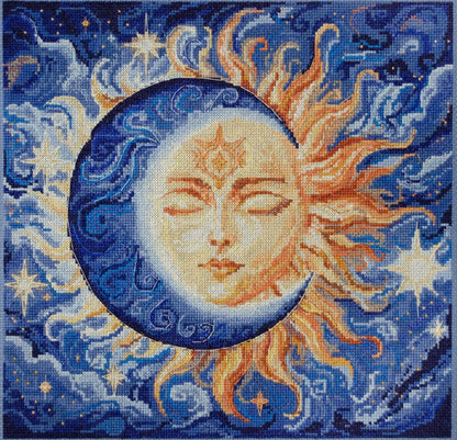 Cross stitch kit depicting a celestial theme with a stylized sun and moon against a starry sky.