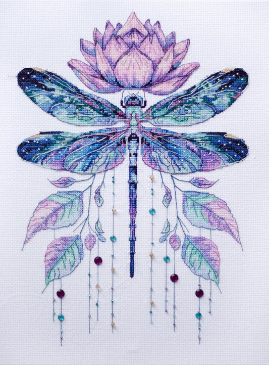 Cross-stitched design of a dragonfly with a lotus flower on a white background