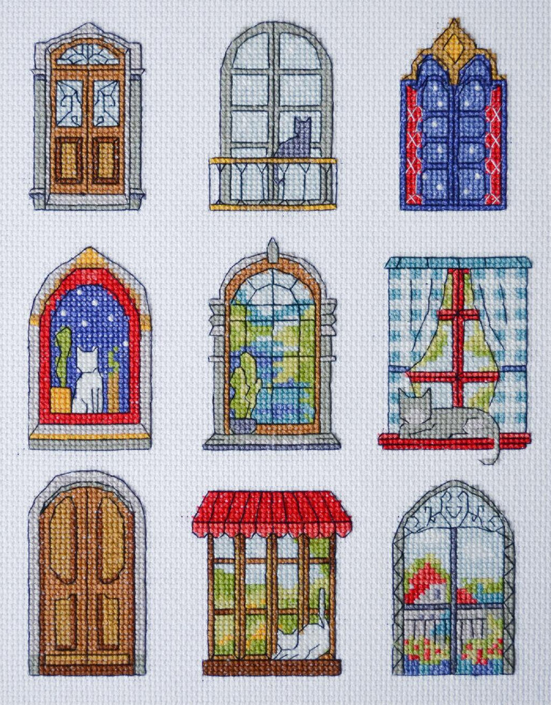 Collection of cross-stitched windows with various designs and scenes.