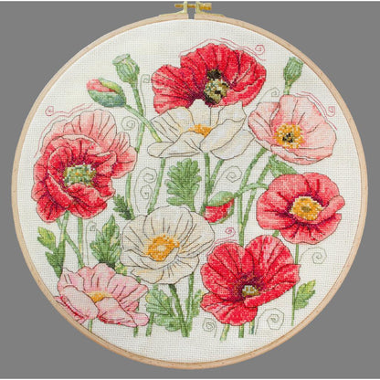Embroidery hoop with floral design on a gray background