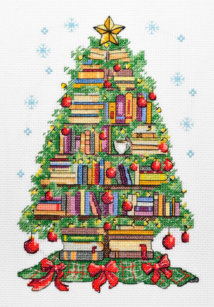 Cross-stitched Christmas tree design with books, ornaments, and a star on a white background with snowflakes.