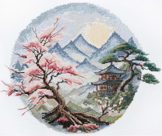 Cross-stitched design of cherry blossom tree and pagoda with mountains in the background