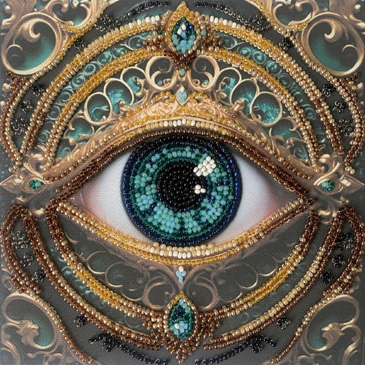 Decorative eye design with gold, blue, and black elements on a textured background
