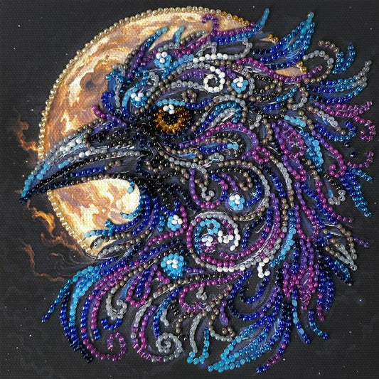 Decorative beaded design of a rooster's head on a dark background