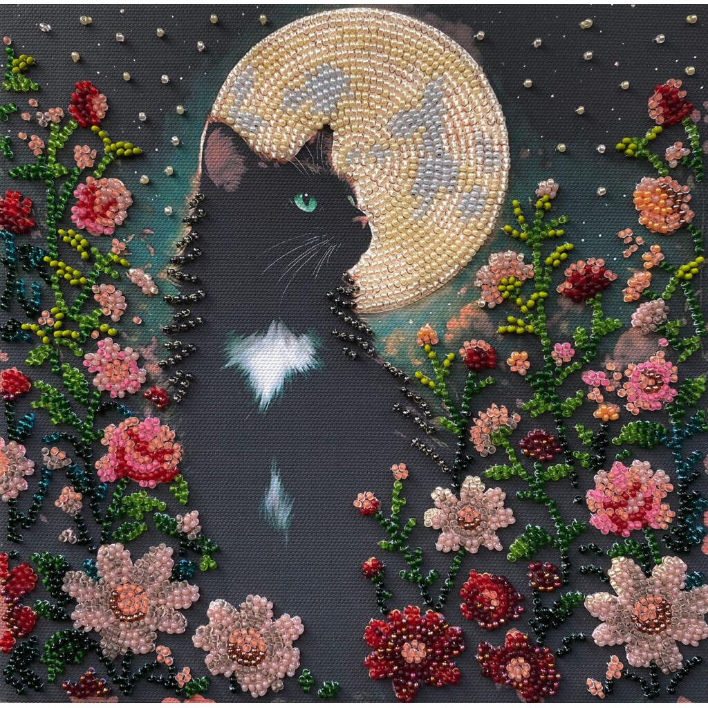 Beaded artwork of a black cat surrounded by flowers and a moon.