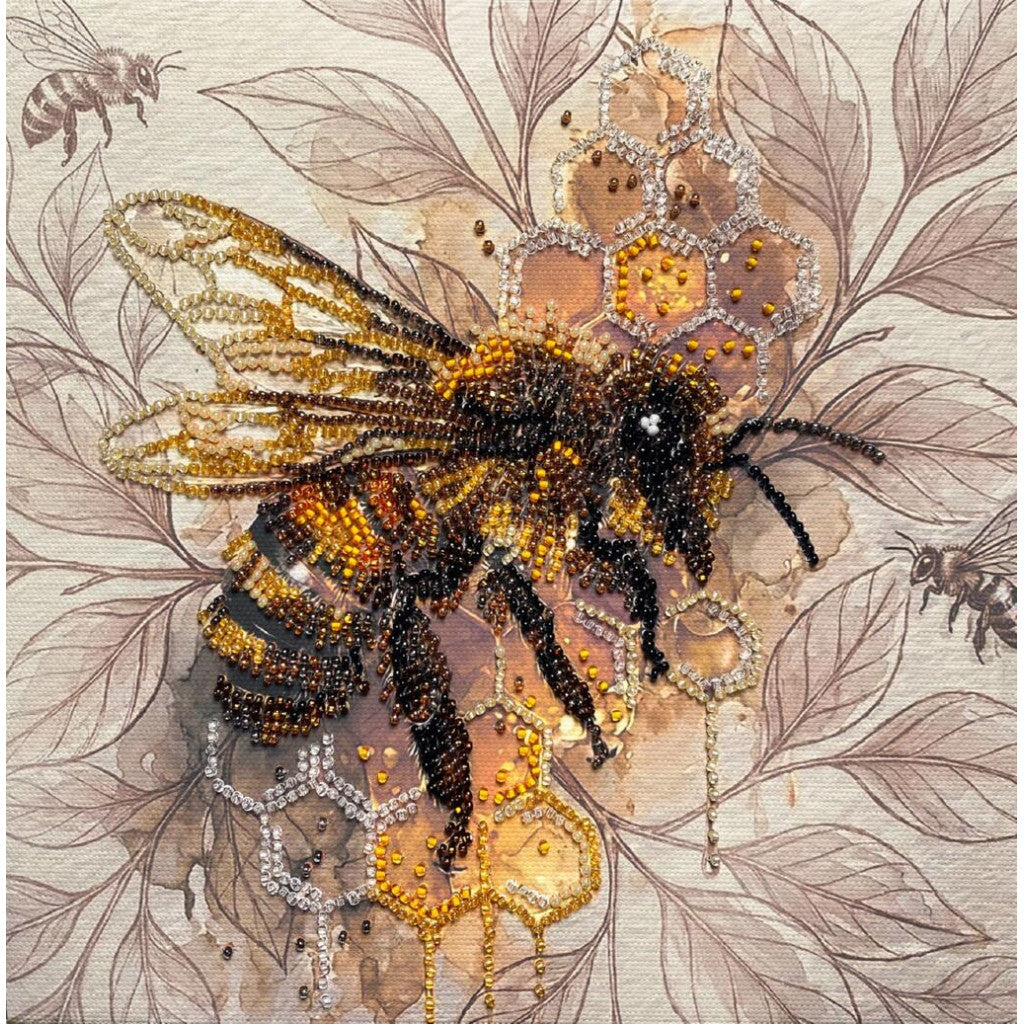 Decorative bee with beadwork on a leafy background