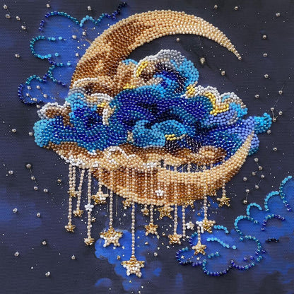 Decorative beaded artwork of a crescent moon and clouds on a dark background