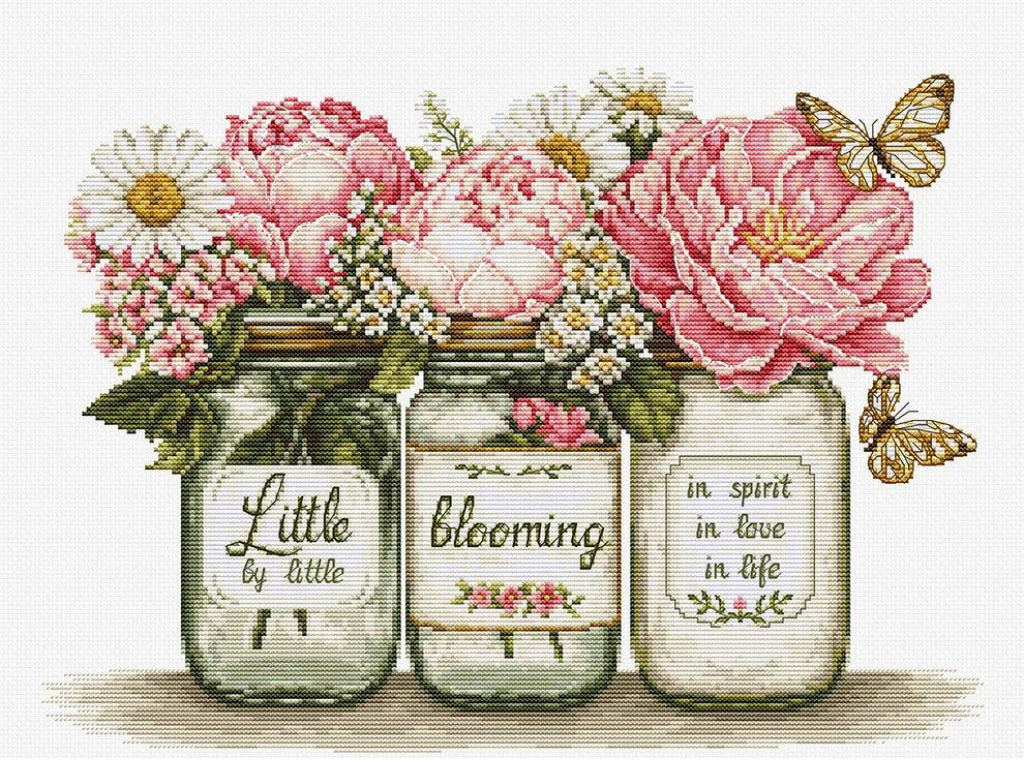 A decorative floral arrangement featuring three glass mason jars with embroidered-style labels reading 'Little by little,' 'blooming,' and 'in spirit in love in life,' topped with pink peonies, white daisies, green leaves, and two gold butterflies on a light background.