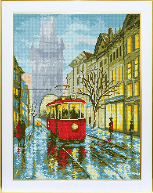 Cross-stitched city scene with a red tram on a snowy street.