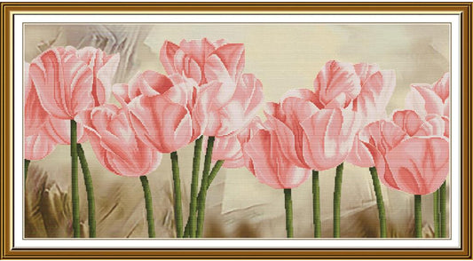A framed floral artwork featuring pink tulips with green stems against a soft beige background, enclosed in a white mat and ornate gold frame.