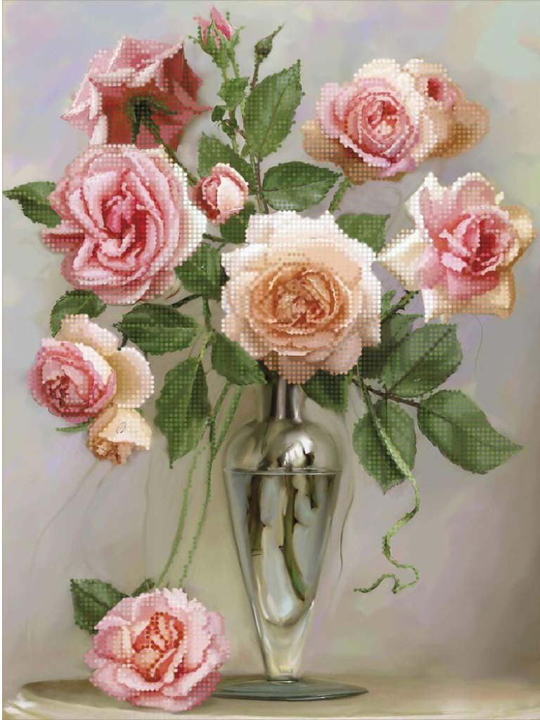 Bouquet of pink and white roses in a clear vase on a light background
